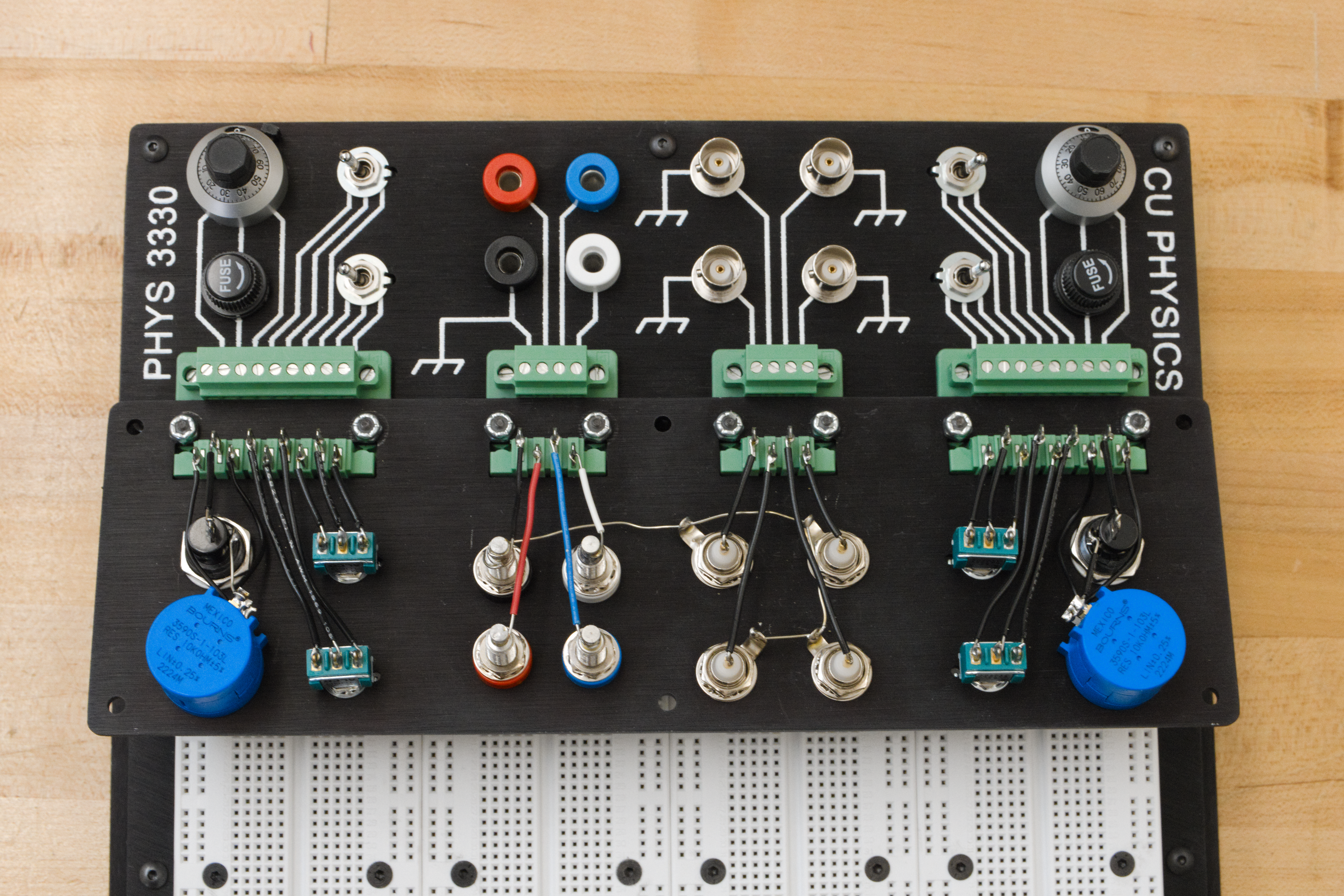 A breadboard with a header attached (a second header is shown upside-down to reveal what's going on 'under the hood')